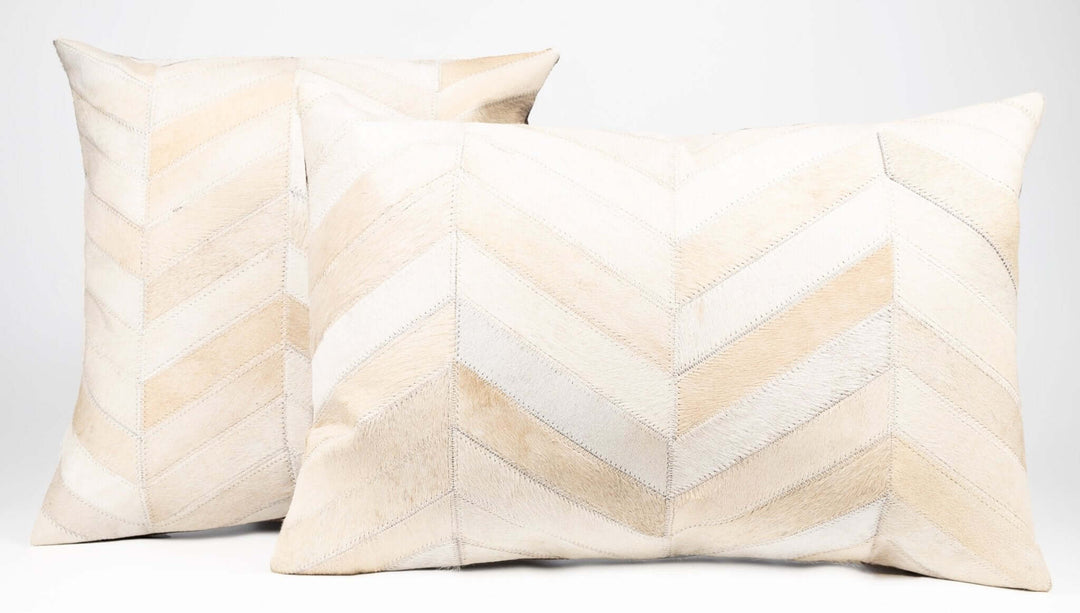 Two decorative pillows with chevron pattern on a white background