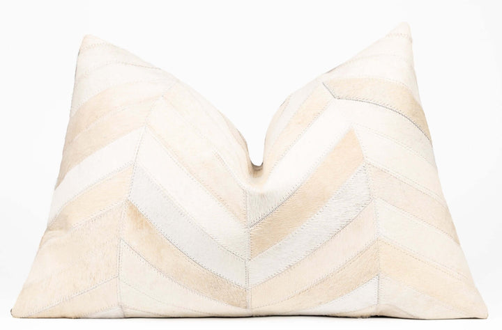 Decorative pillow with chevron pattern on a white background