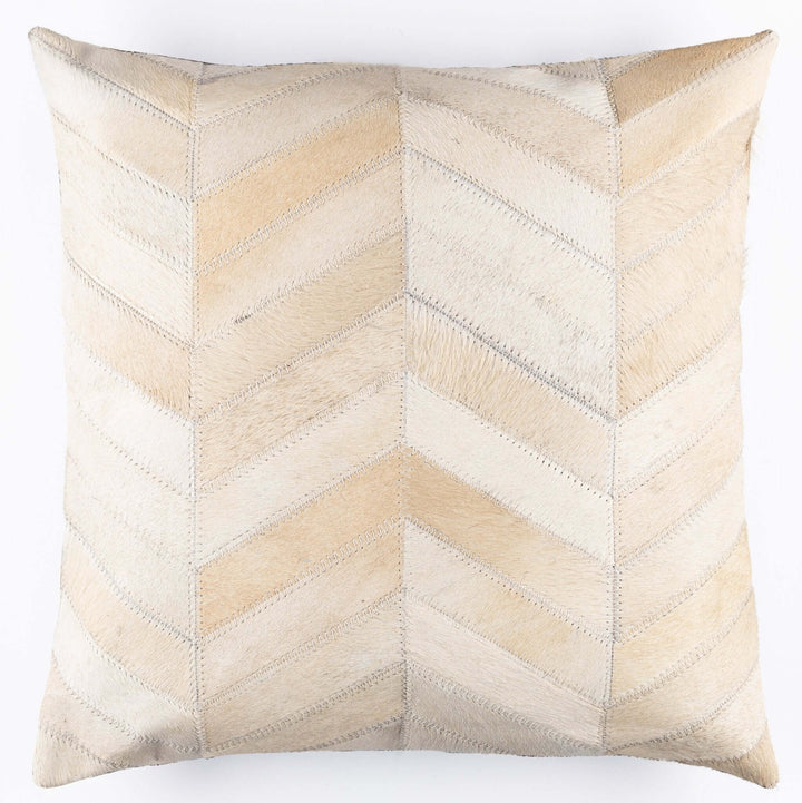 Decorative pillow with a chevron pattern in beige and white on a white background