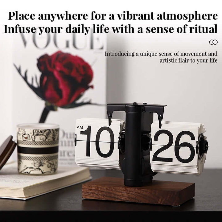 Flip clock on a wooden base with decorative elements in the background