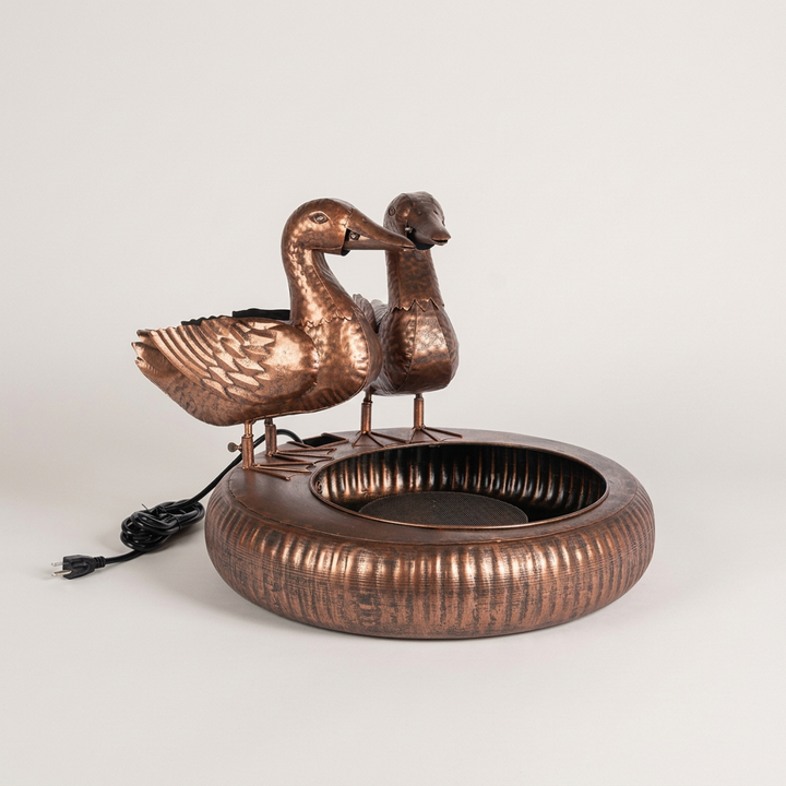 Antiqued Copper Dabbling Ducks Fountain on a pale gray studio background with feather detailing and the full rounded basin visible.