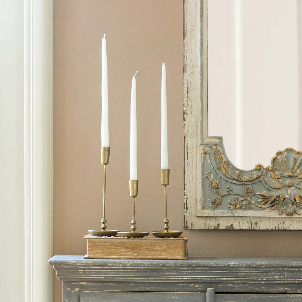 Vintage Antique Gold Iron Taper Candle Holders Set on wooden mantel with mirror in elegant home decor setting