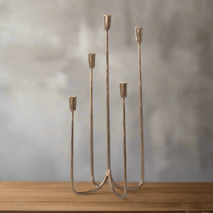 Tall Vintage Brass Candelabra with aged brass finish on wooden surface, showcasing industrial vintage design style.