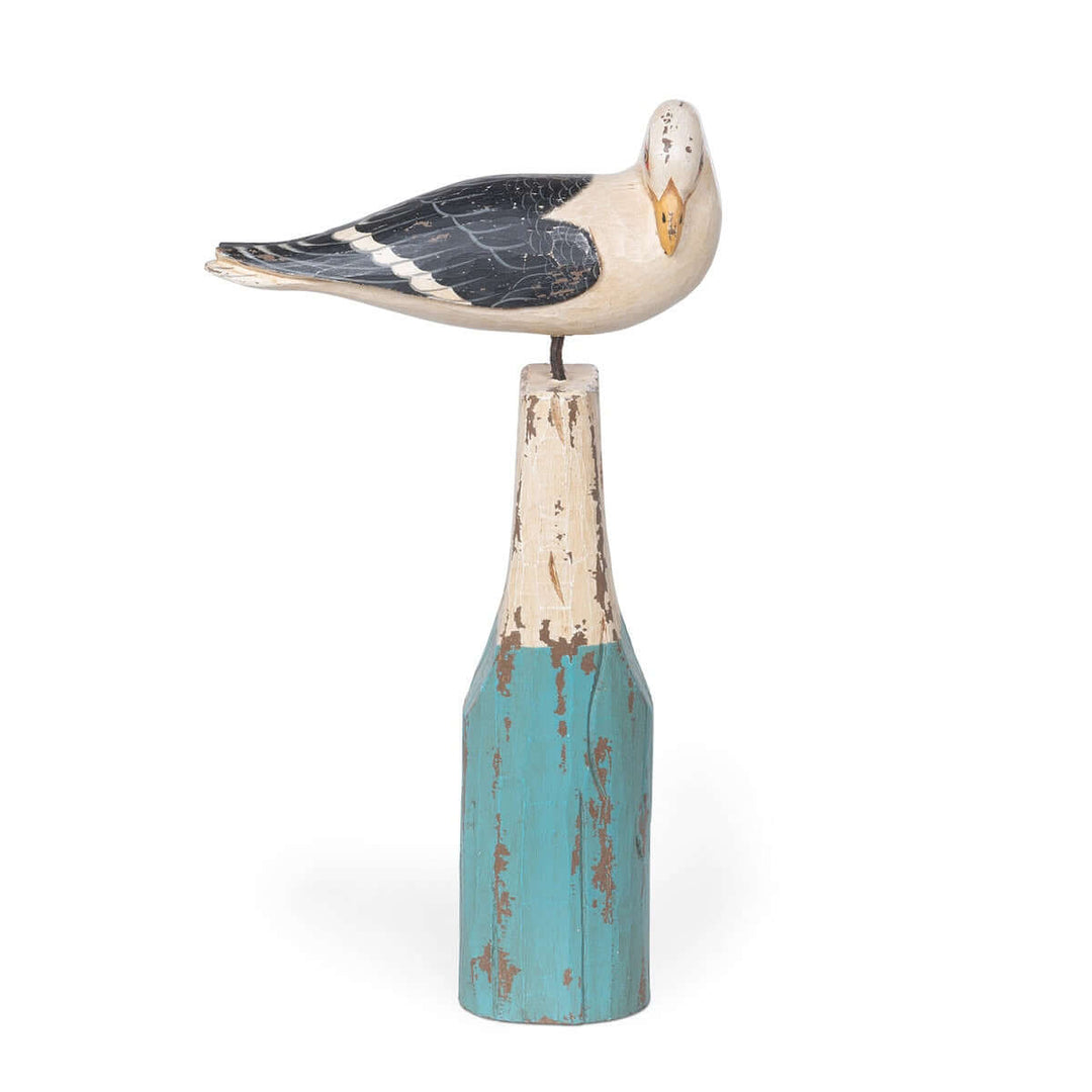 Vintage nautical seagull figurine perched on turquoise buoy, handcrafted from beechwood with a distressed ocean-inspired finish.