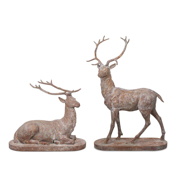 Antique style cast iron deer statues set, featuring a standing stag and reclining deer, ideal for garden decor.