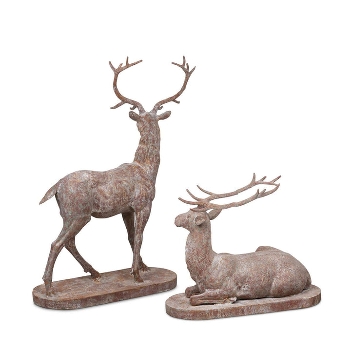 Antique style cast iron deer statues, set of 2, featuring a standing stag and reclining doe, perfect for garden or outdoor decor.