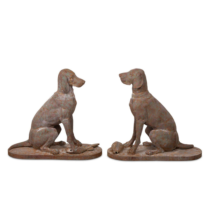 Set of two rustic cast iron hunting dog sculptures, evoking English country manor charm for home or garden decor.
