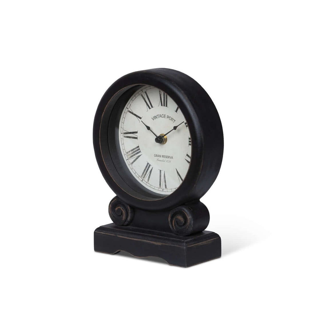 Antique-style mantel clock with Roman numerals and black finish, featuring an ivory dial for vintage home décor elegance.