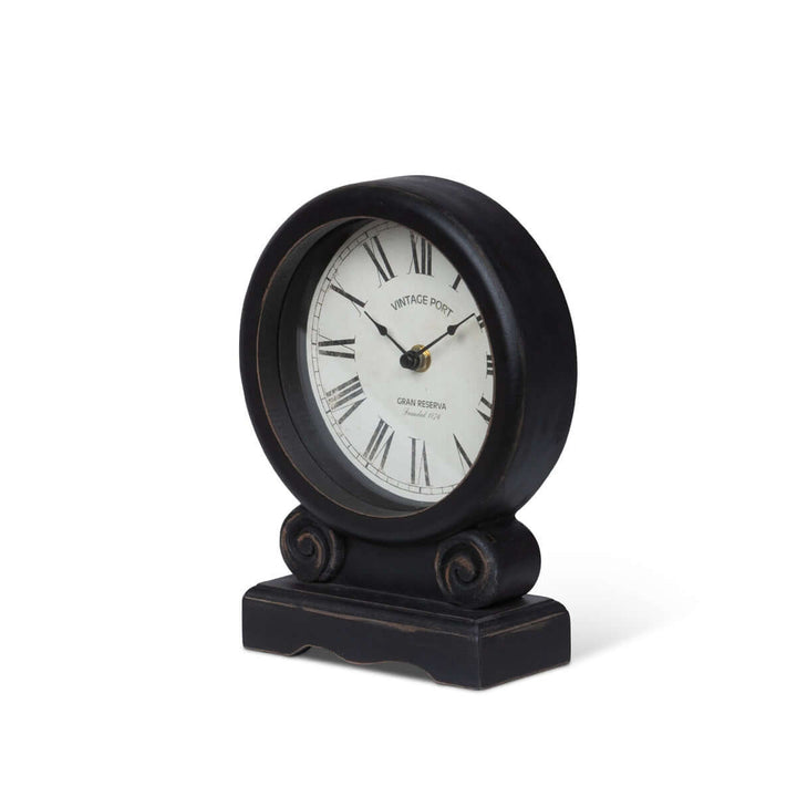 Antique-style mantel clock with Roman numerals and black finish, featuring an ivory dial for vintage home décor elegance.