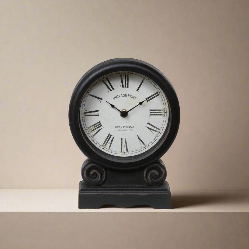 Antique-style mantel clock with Roman numerals and faded ivory dial on black distressed finish for vintage home decor.