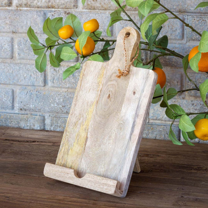 Rustic wooden farmhouse cookbook holder shaped like a paddle cutting board, perfect for vintage kitchen decor and functionality.
