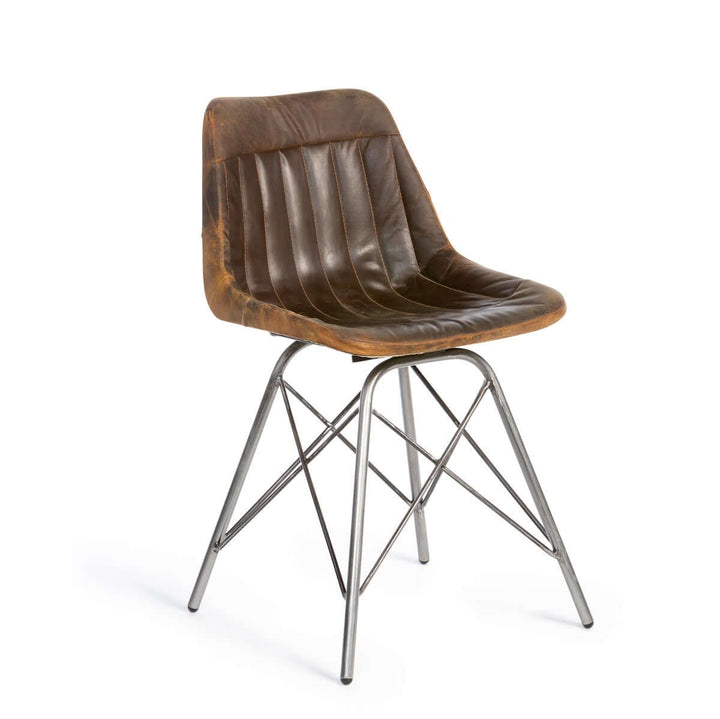 Vintage industrial desk chair with aged leather seat and metal legs, showcasing rugged charm and craftsmanship for your workspace.