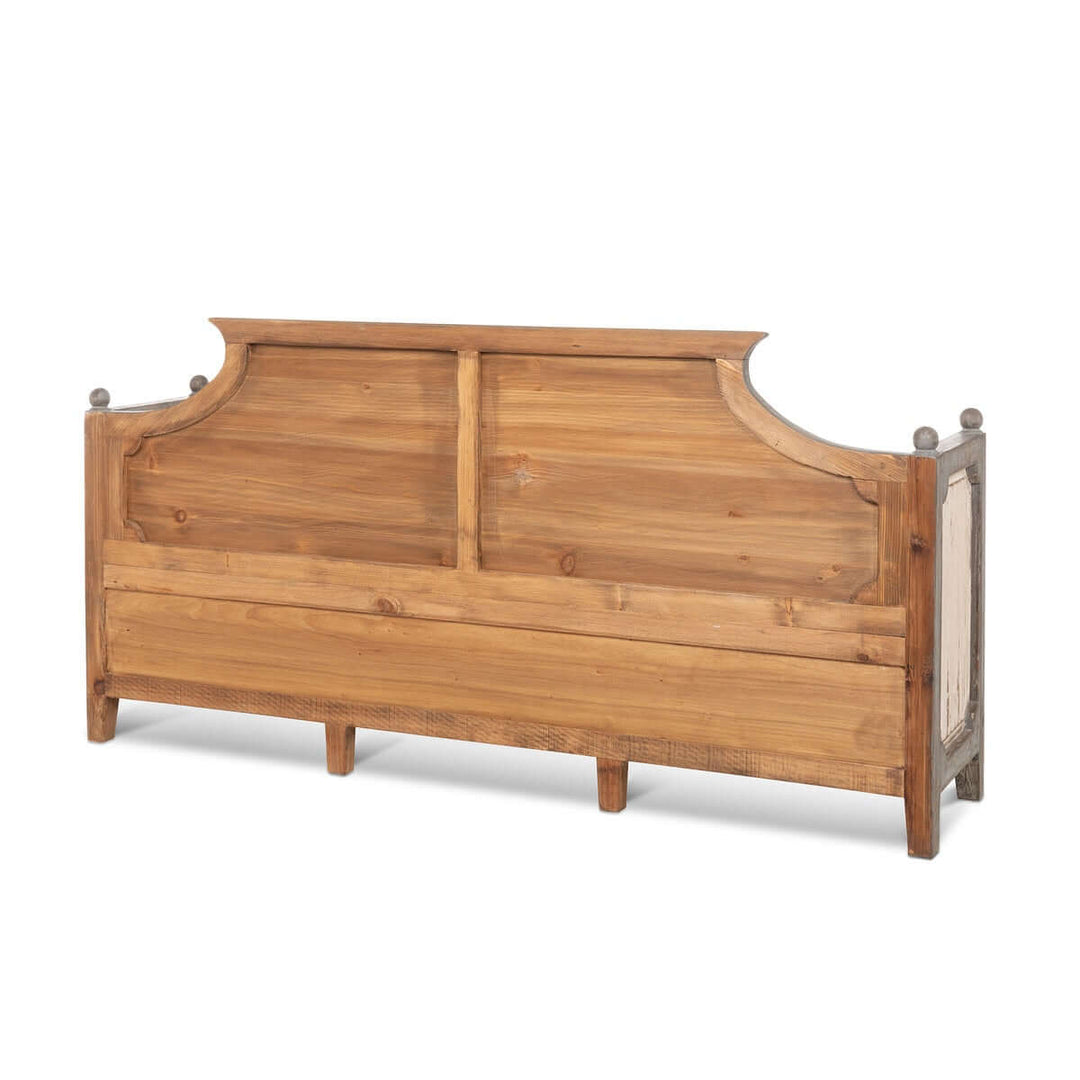 Antique distressed wood French country bench with curved back and panel accents, perfect for rustic elegance and farmhouse decor.