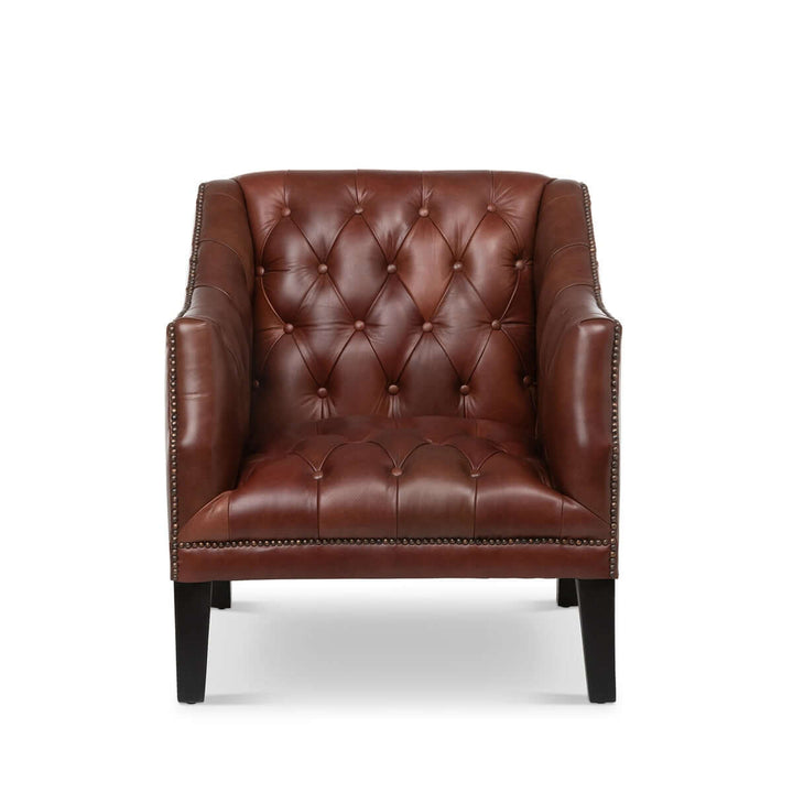 Tufted leather club chair in cordovan brown with nailhead trim, perfect for adding classic elegance to any room.