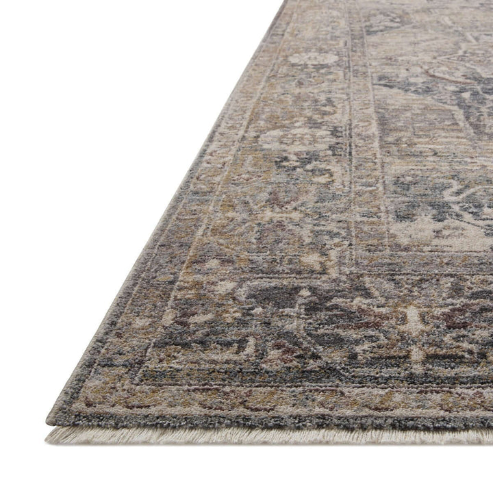 Traditional distressed loomed rug with vintage medallion design, featuring a soft, antique finish and intricate detailing.