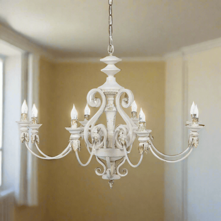 Rustic French Country chandelier with gold leaf accents and distressed cream finish, evoking antique charm and Provençal elegance.