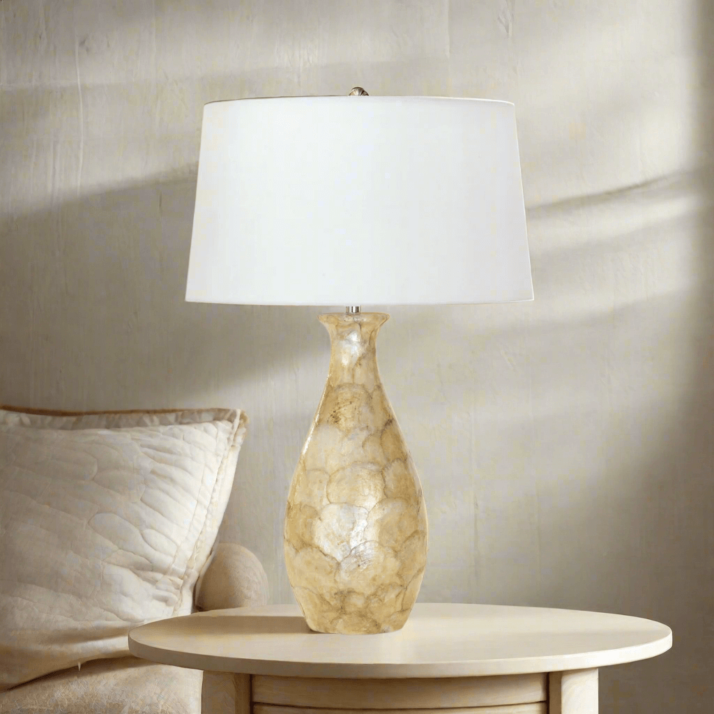 Coastal Pearl Capiz Shell Table Lamp with Linen Shade on elegant side table, illuminating rustic decor.