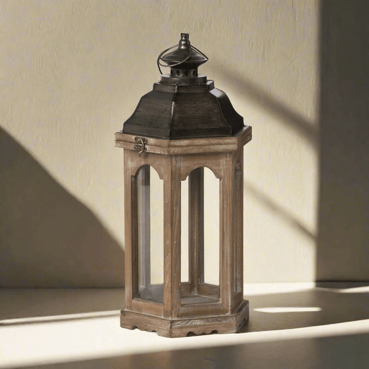 Vintage rustic wooden lantern with hexagonal design for farmhouse and cottage decor, casting a nostalgic shadow on a sunny day.