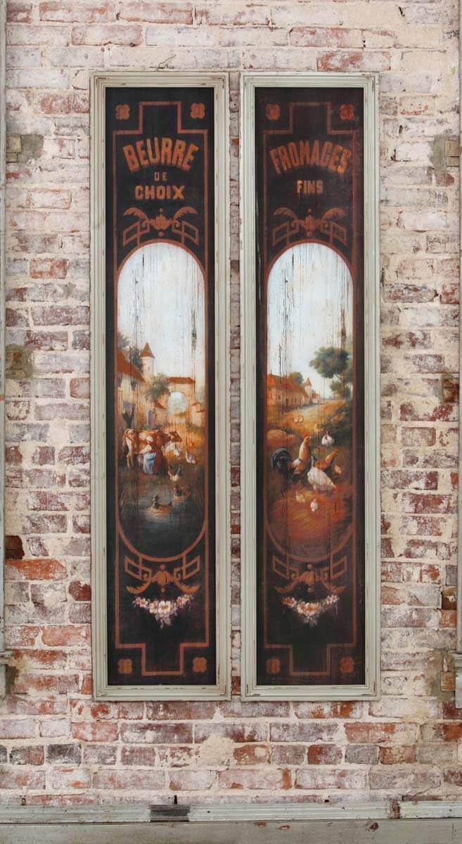 French Country Kitchen Wall Art featuring vintage butter and cheese signs on rustic wooden panels against a brick wall.