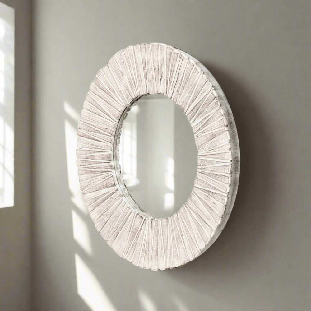 Whitewashed wood slat round wall mirror with natural texture and handcrafted design, reflecting light and elegance. Home decor.