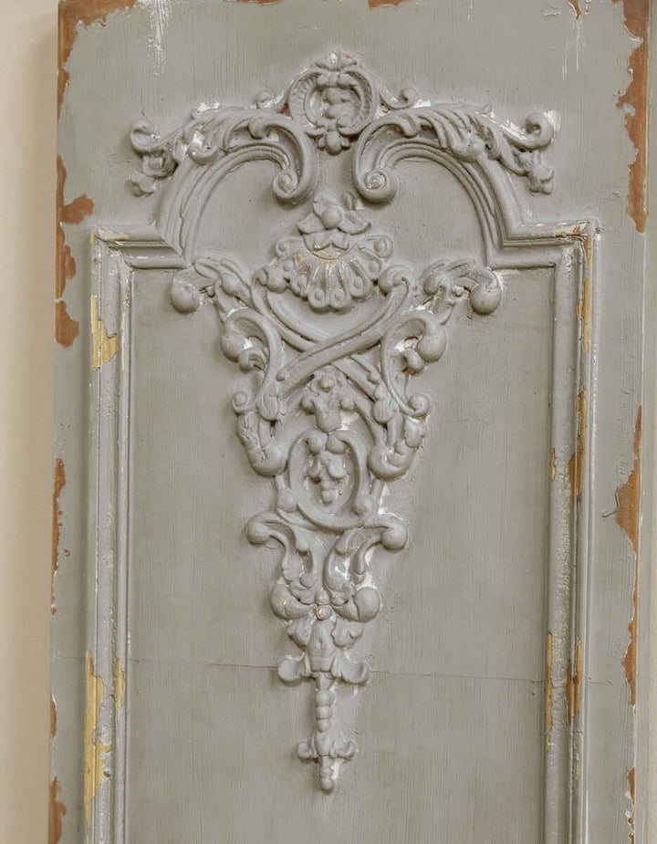 Distressed French wall panel with Art Nouveau scrollwork, grey patina finish, antique decor piece.