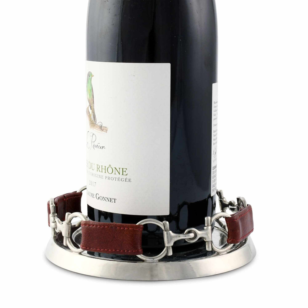 Wine bottle with a decorative coaster on a white background