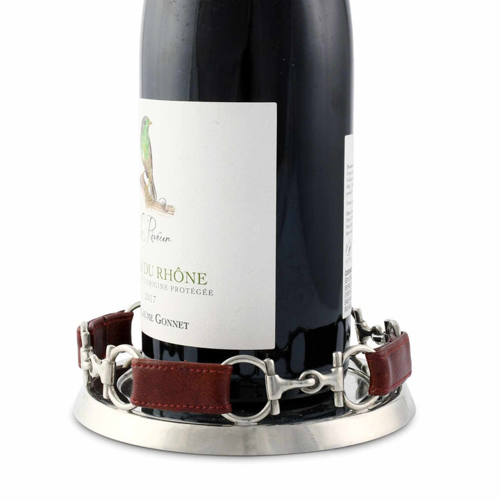 Wine bottle with a decorative coaster on a white background