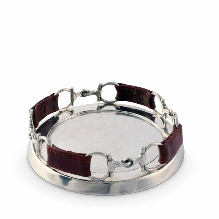 Silver horse bit with brown leather straps on a white background