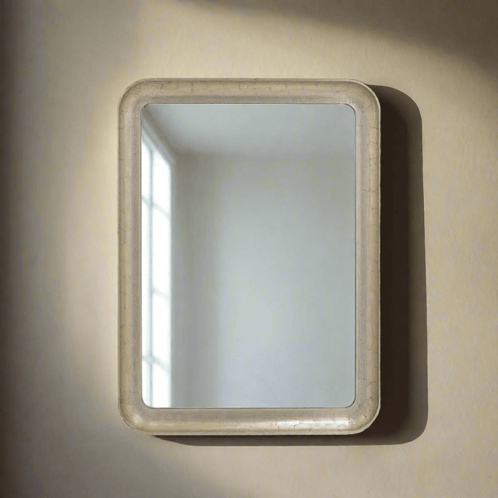 Art Deco Champagne Silver Wall Mirror with beveled glass on neutral wall, vintage European design inspiration.