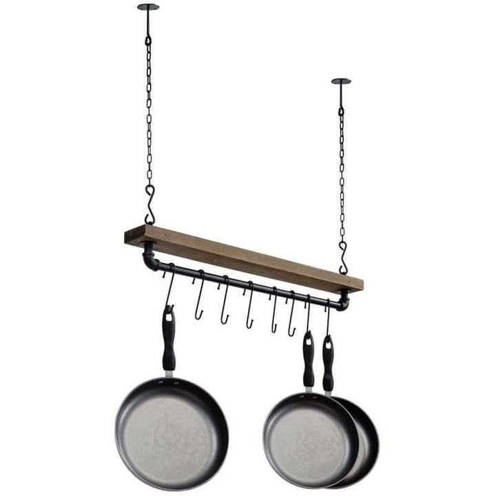 Wooden pot rack with hanging hooks and pans on a white background