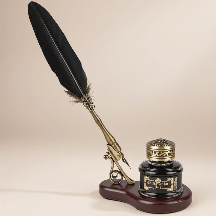 Feather quill pen with inkwell on a beige background