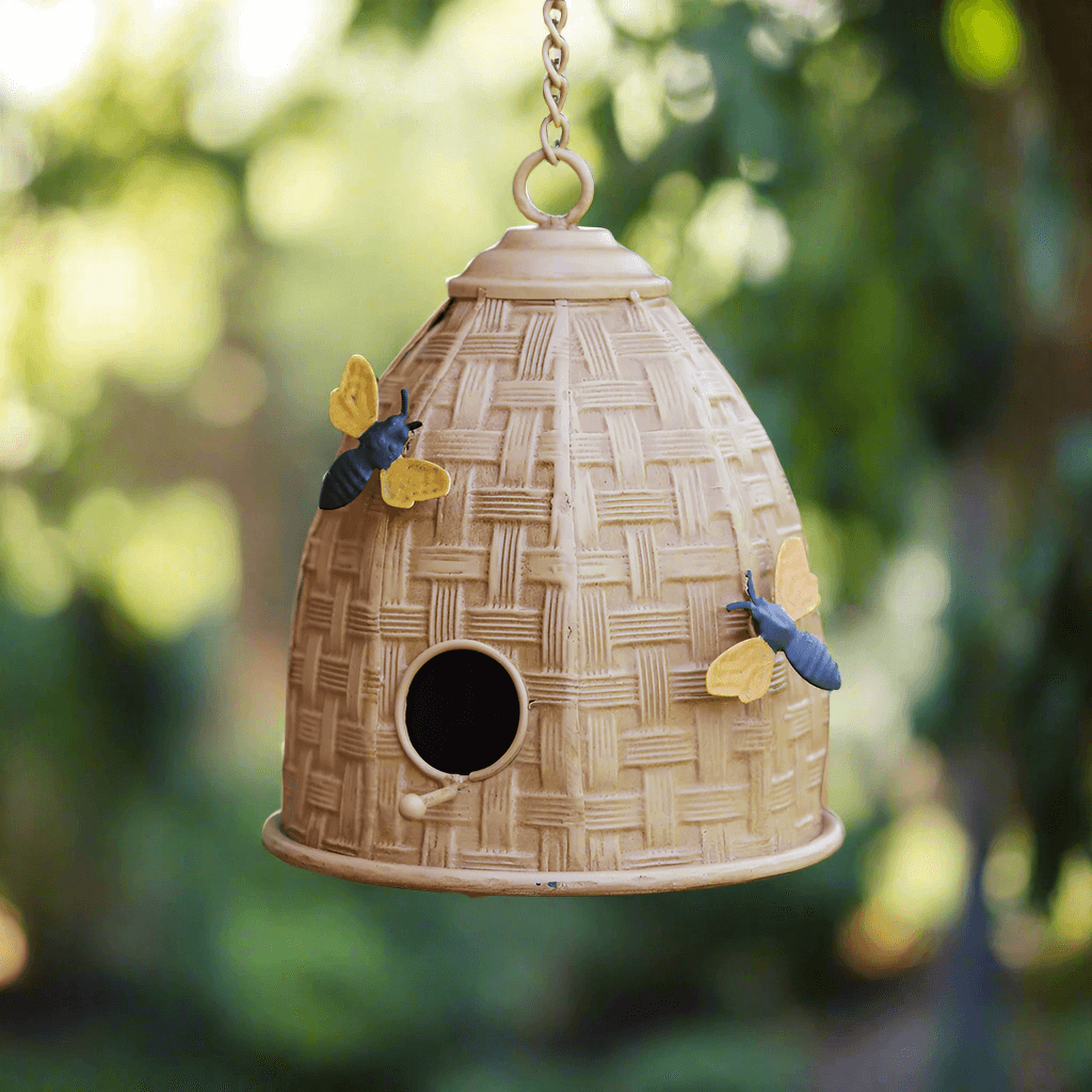 Farmhouse beehive birdhouse with bees, perfect for garden charm and attracting feathered friends.