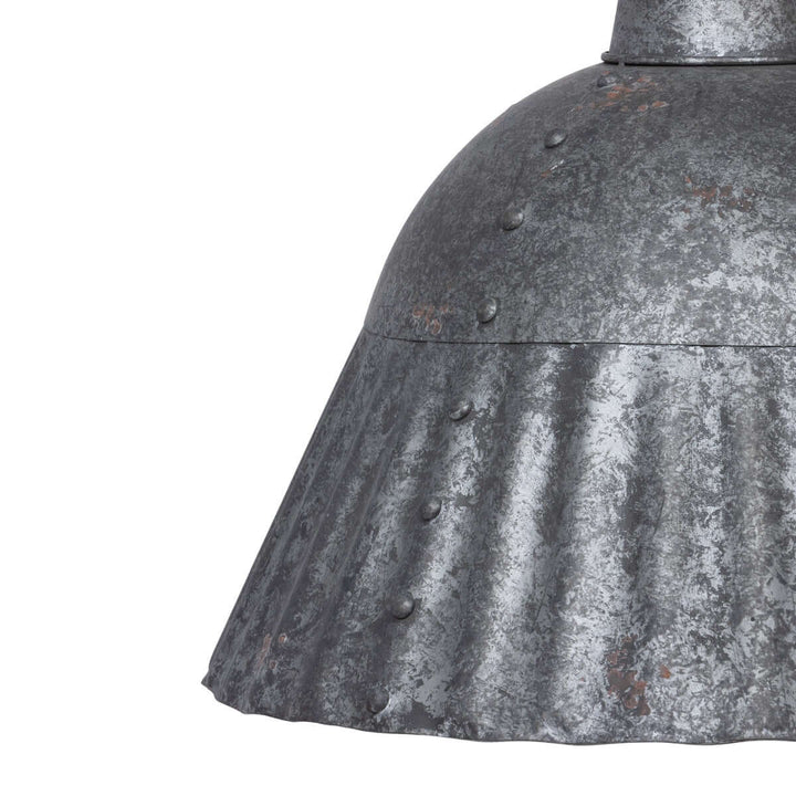 Close-up of a textured metal surface with rivets on a white background