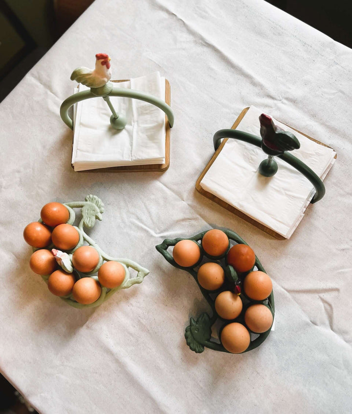Rustic farmhouse napkin holders featuring roosters and eggs, perfect for adding charm to kitchen decor.