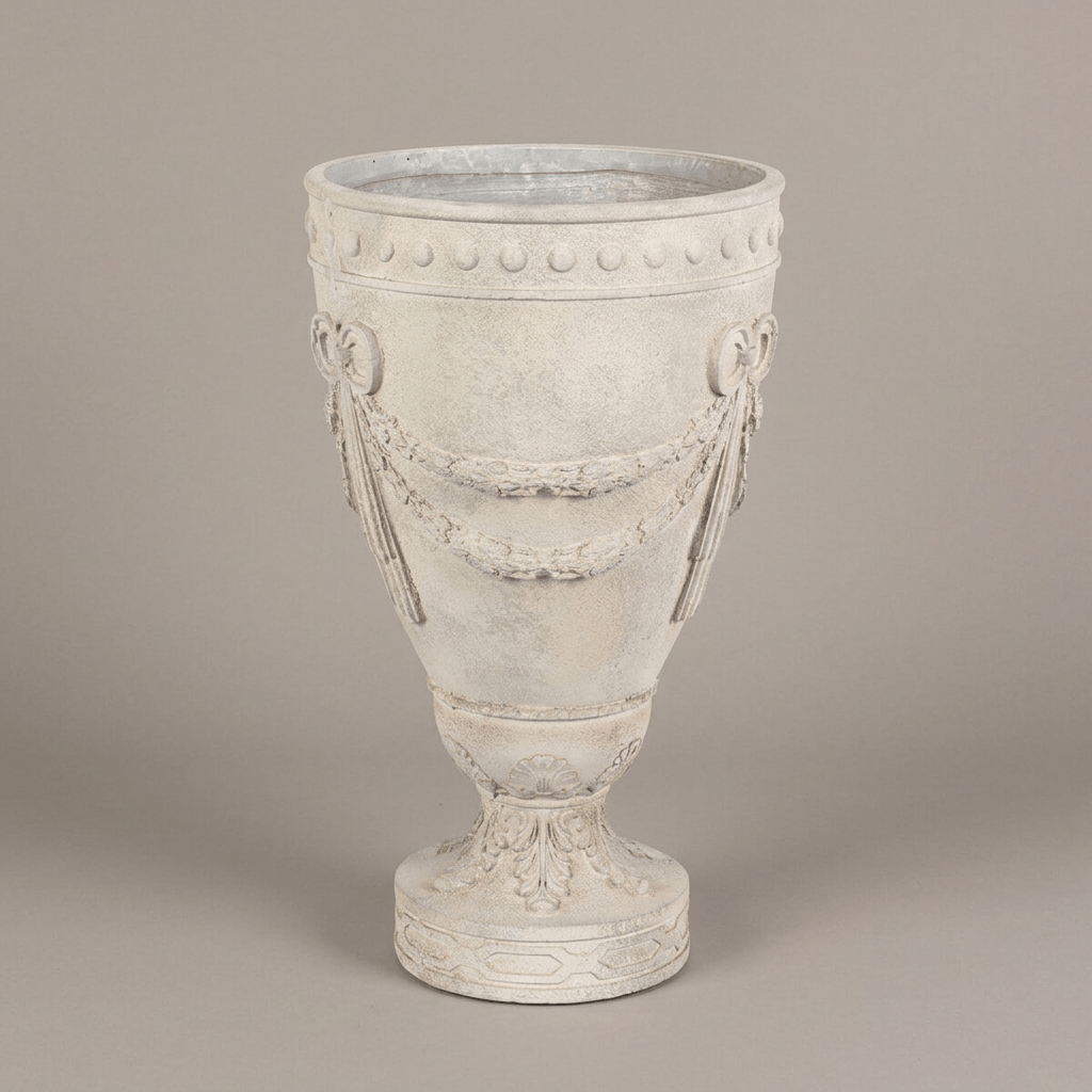 Full view of the ivory Florentine Floral Urn Planter showing floral garlands, medallions, and an ornate circular pedestal against a neutral background.