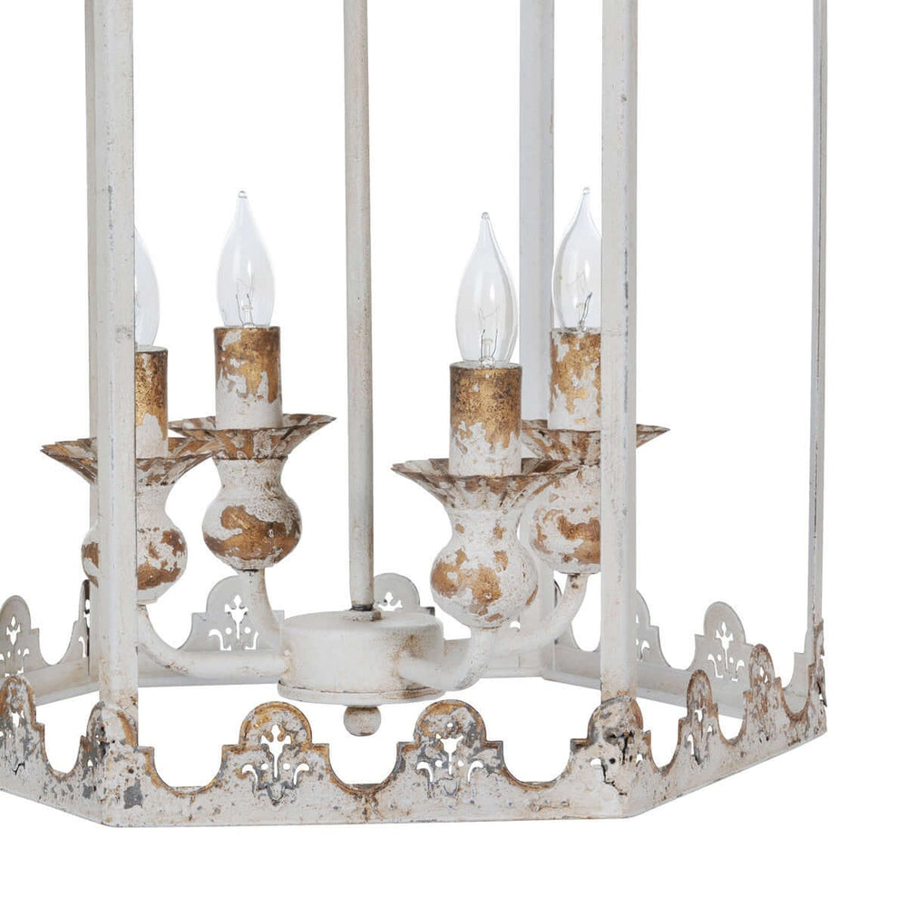 Vintage-style chandelier with white and gold accents on a white background