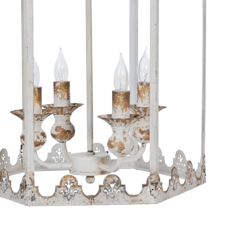 Vintage-style chandelier with white and gold accents on a white background