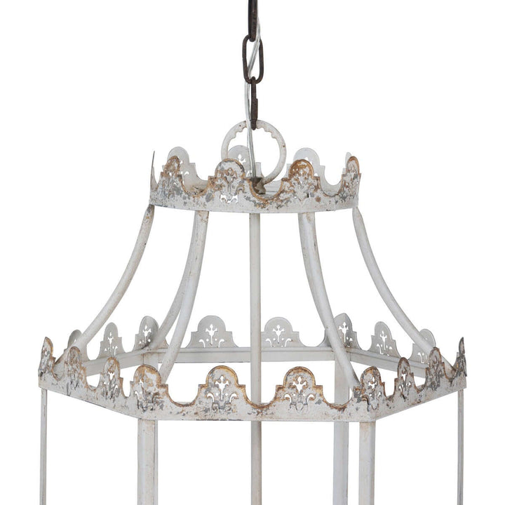 Decorative white lantern with intricate patterns on a white background
