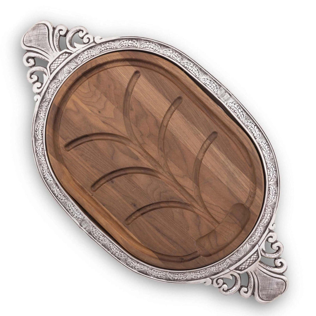 Decorative wooden tray with silver rim and intricate designs on a white background