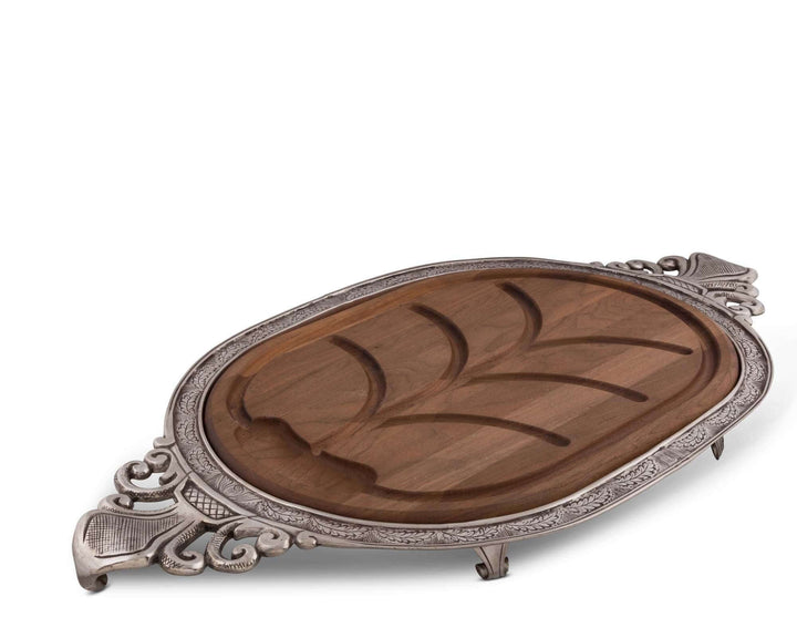 Wooden tray with silver decorative rim on a white background