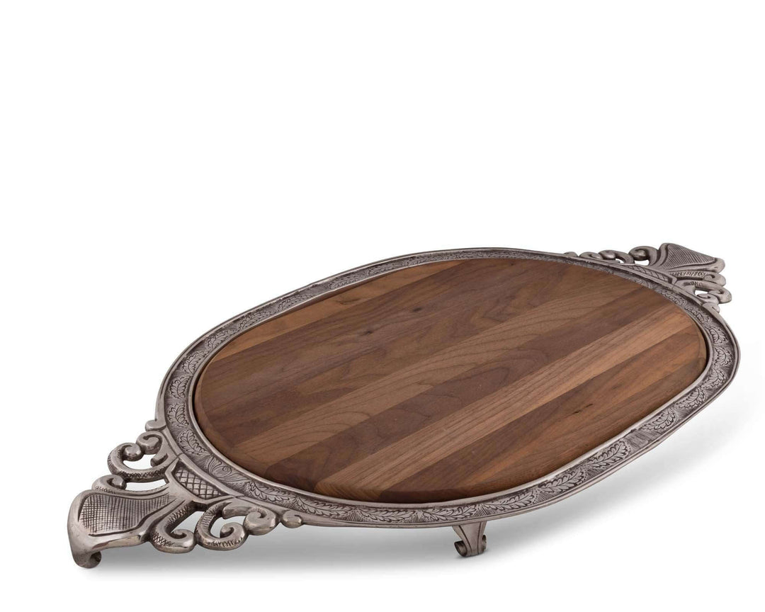 Wooden tray with decorative silver metal frame on a white background