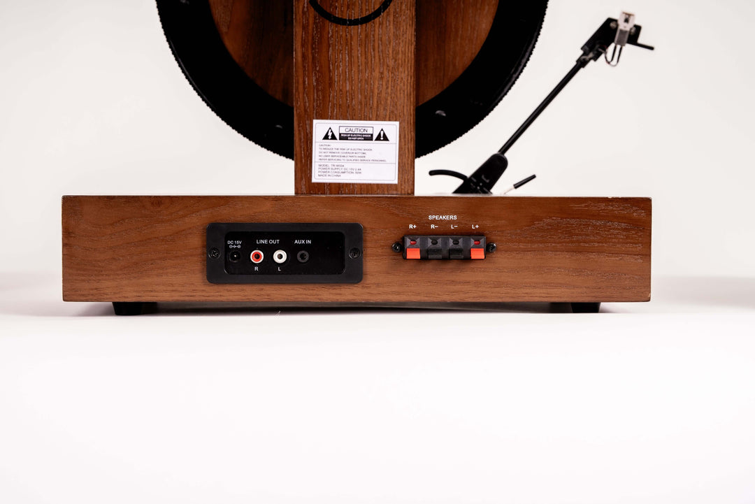 Wooden record player with control panel on a white background