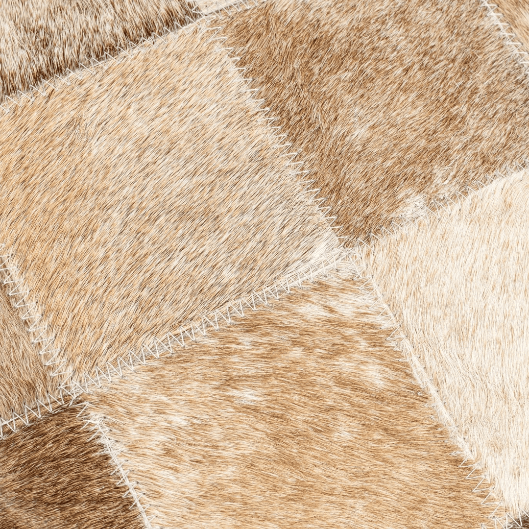 Close-up of a brown and beige patterned pillow with geometric design