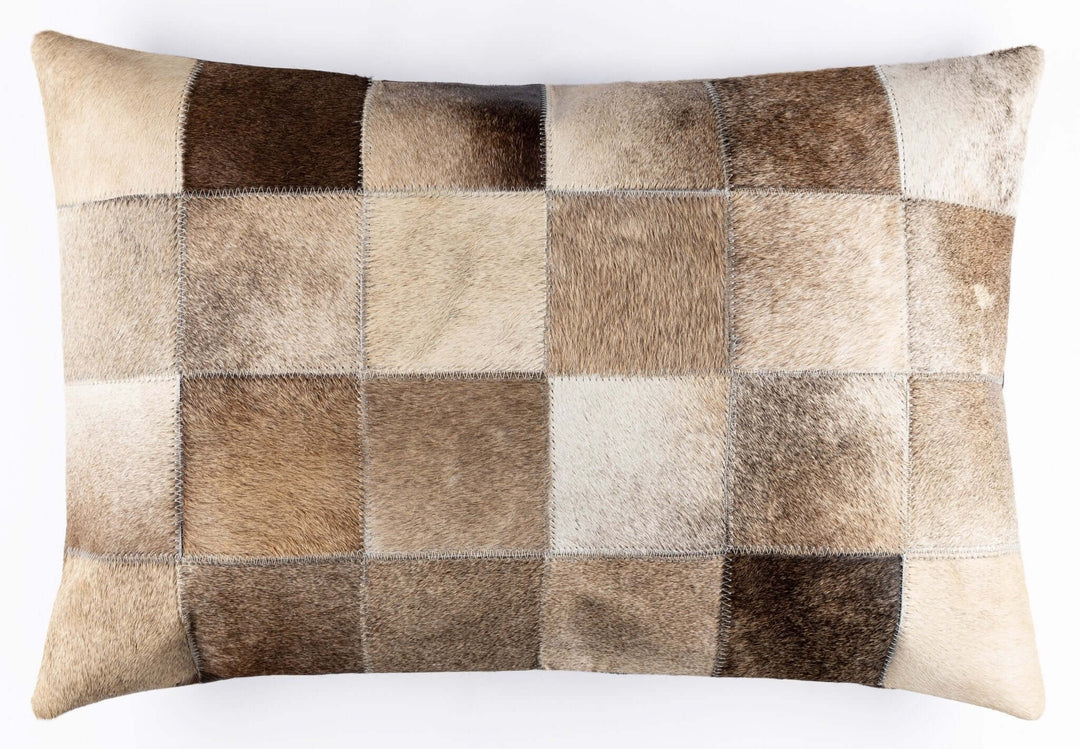 Patchwork pillow with brown and beige squares on a white background