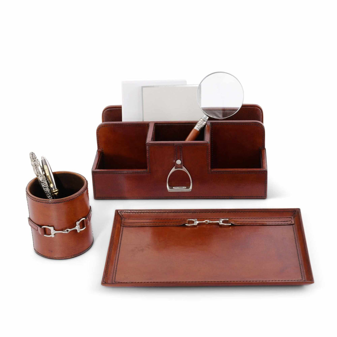 Brown leather desk set with organizer, pen holder, and tray on a white background