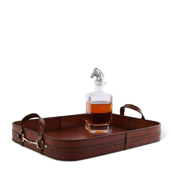 Brown leather tray with a glass decanter on a white background