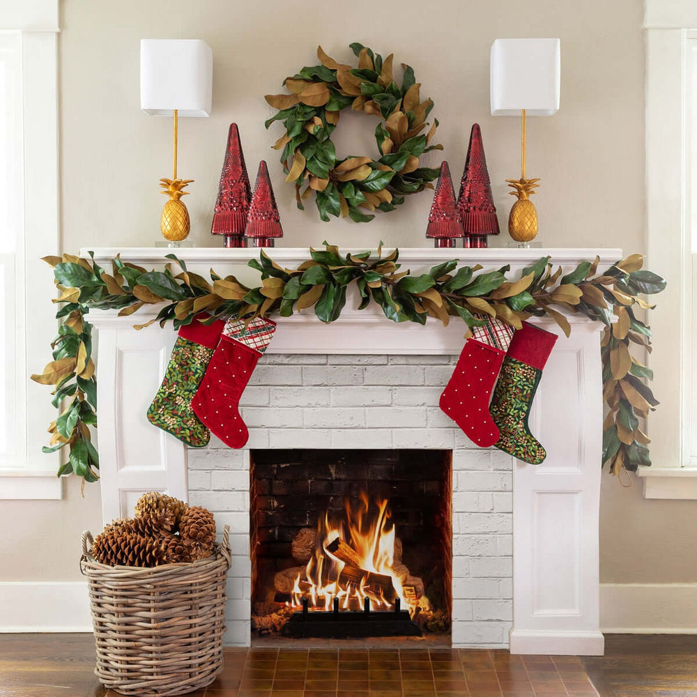 Decorated fireplace with stockings, wreath, and festive decor