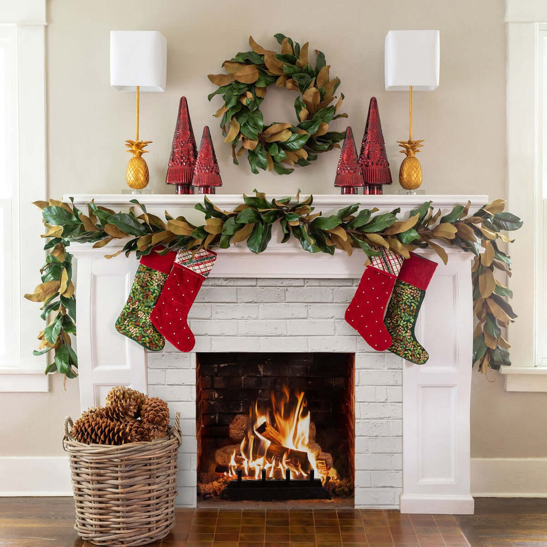 Decorated fireplace with stockings, wreath, and festive decor