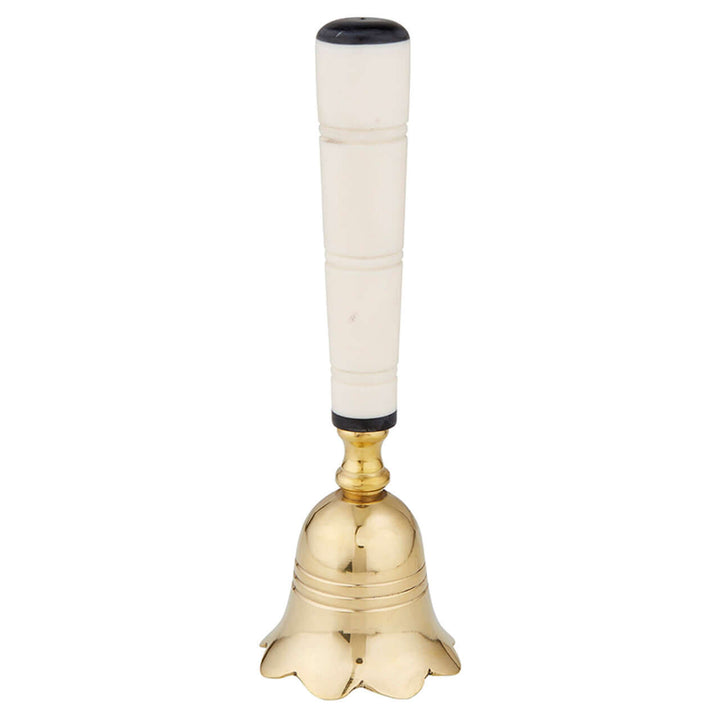 Gold bell with a white handle on a white background