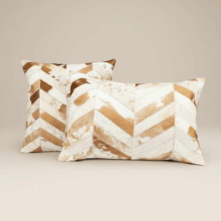 Two decorative pillows with chevron pattern on a beige background